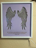 Angel wings wall decor with inscription and LED lighting