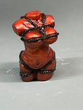 Female figurine with rope