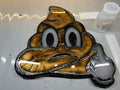 Poo emoji finger